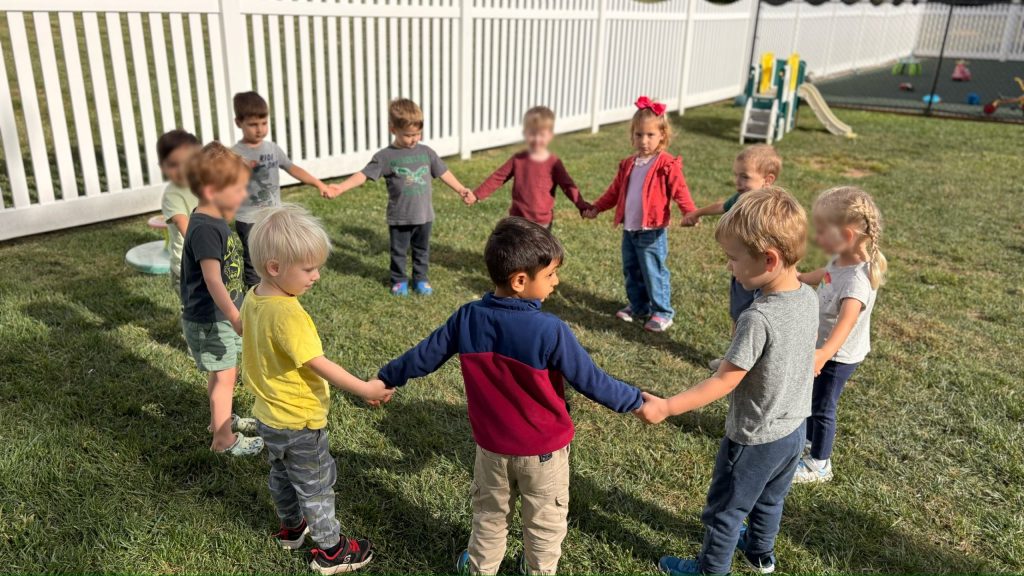 Children enjoying outdoor learning at Little Sprouts