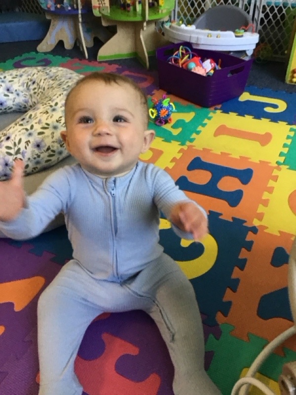 A smiling infant at Little Sprouts